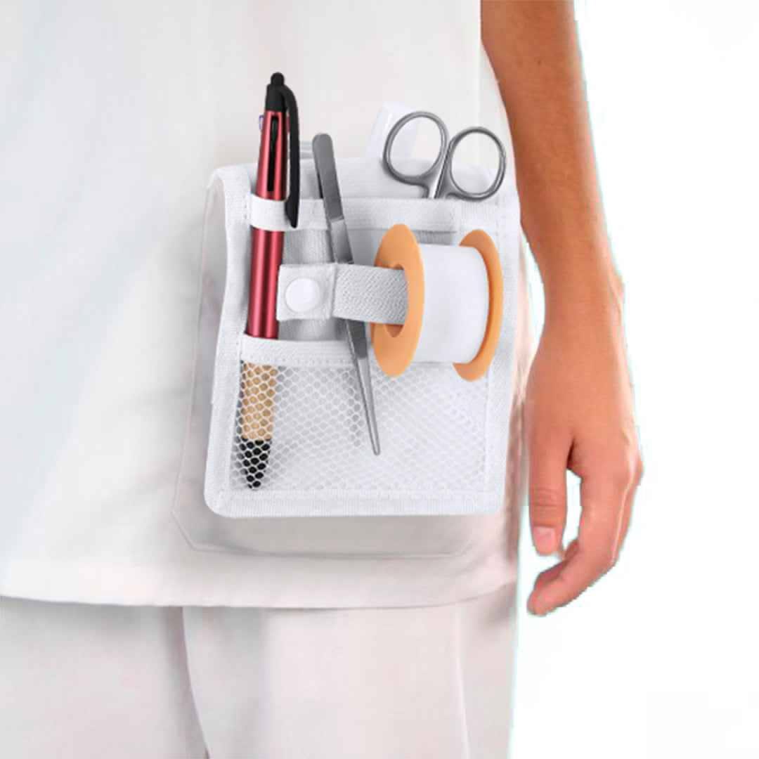 Scrub pocket organiser insert holding scissors, pens, tape and a penlight