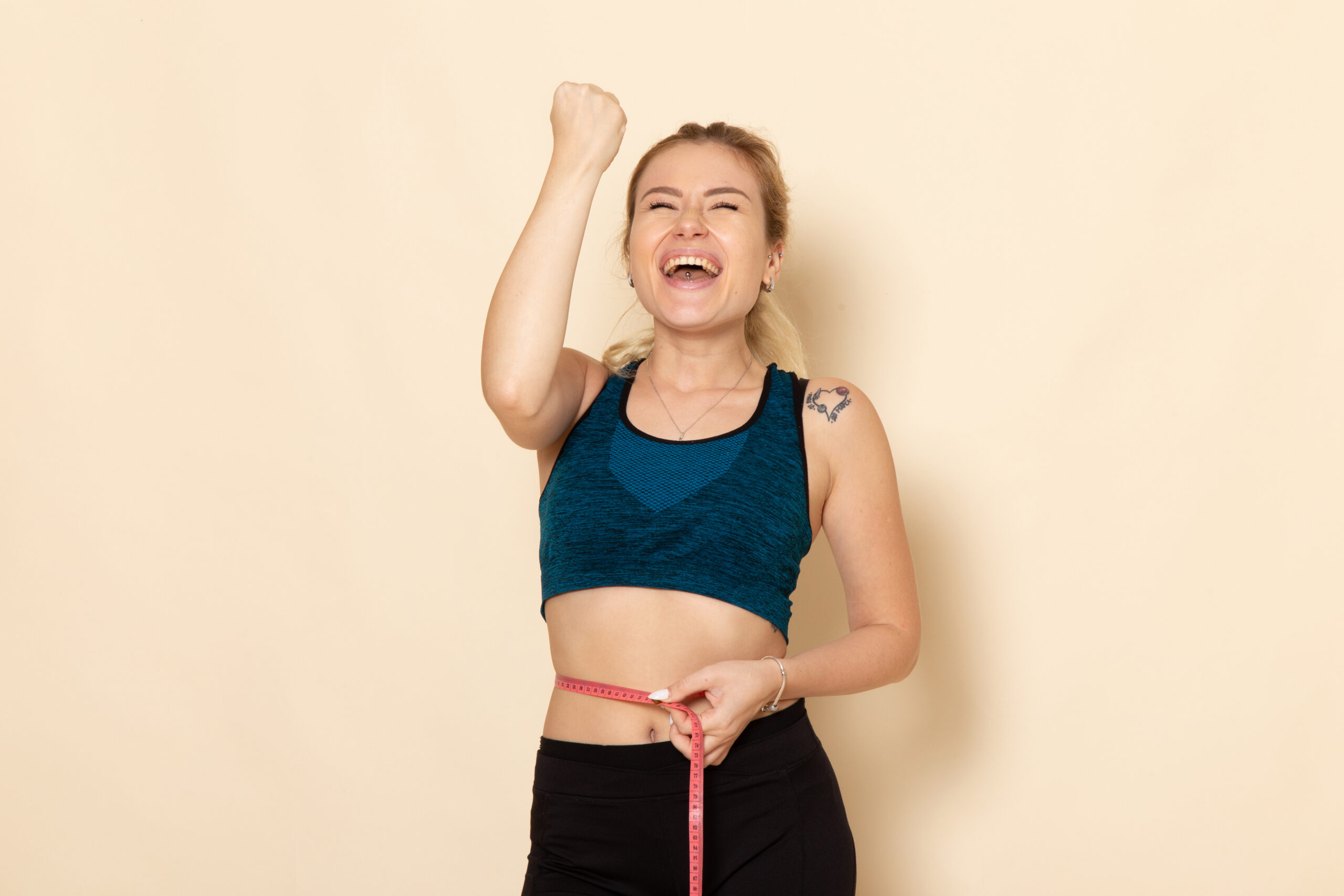 A happy woman achieving her weight goal